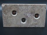 a close up of a piece of metal on a table