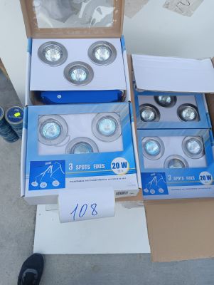 four boxes of light bulbs sitting on top of a cardboard box
