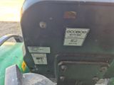 a close up of a green tractor with a number plate on it