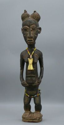 a close up of a statue of a person with a necklace