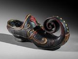 a black and red shoe with a spiral design on it