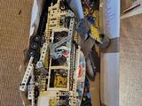a box full of assorted legos on the floor