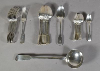 a lot of silver spoons and spoons on the table
