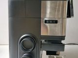 an image of a coffee maker on a white table