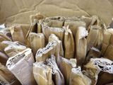 a box full of brown paper bags sitting on a table