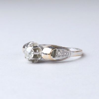 an image of a diamond ring on a white surface