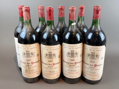 six bottles of wine are lined up in a row on a table