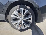 a close up of a car wheel on the street