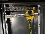 a rack with a bunch of wires in it