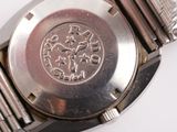 a close up of a watch on a white surface