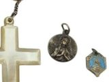 a cross, rosary, and other religious items on a white background