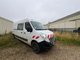 a white van that is parked in front of a building