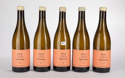 four bottles of wine are lined up on a white surface