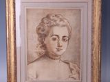 an old picture of a woman in a white dress is on a wooden easel