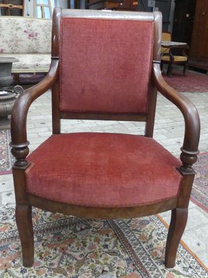 Un FAUTEUIL Empire en bois de placage, assise en velours vie…