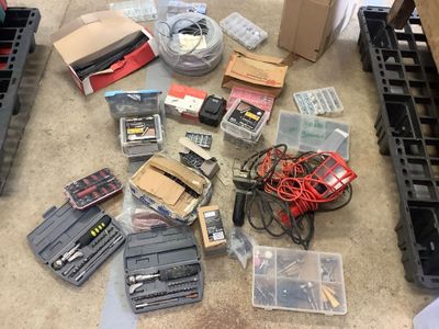 a lot of assorted electronics on the floor