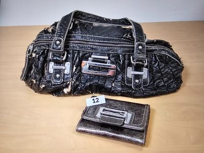 a purse and wallet sitting on a table next to each other