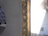 a mirror that is hanging on the wall in the room