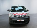 a white van with red and white stripes parked in a room