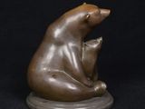 bronze sculpture of a bear and cub on a black background