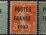 four different postages with different colors and designs on them