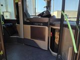 a view of the inside of a bus from the driver ' s seat