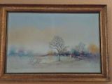 a picture of a painting on the wall above a bed