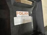 a black piano with a label on it sitting in front of a wall