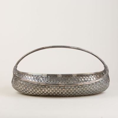 a silver metal basket with a handle on a white background