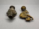 pair of antique brass door handles with a lion head and a lion head