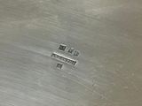 a metal pan with four small squares on it