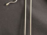 pair of antique metal walking canes on a black background