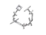 a close up of a bracelet with a cross on it
