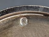 a close up of a metal pan with a hole in it
