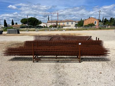 a bench that is sitting in the middle of a dirt field