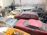 many cars that are parked in a garage