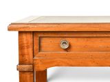 a small wooden table with a drawer on it
