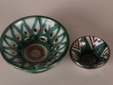 a small bowl and a small bowl sitting on a table