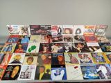 a table with a lot of different album covers on it