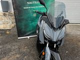 a black motorcycle parked in front of a building