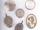 several antique silver objects including a locke, a ring and a picture of a woman