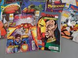 some of the comic books are on a table next to each other