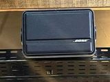 a suitcase sitting on top of a shelf in a room