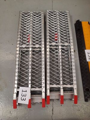 three different types of steel grates are on display in a warehouse