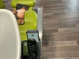a picture of a dental chair with a phone in it