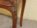 a wooden table with a wooden top and a wooden chair with a wooden seat