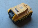 an image of a yellow and black power tool on a table