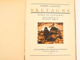 an open book with a picture of a man and a woman sitting on a horse drawn carriage