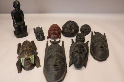 many different types of african masks on a table