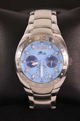 a close up of a wrist watch on a display case